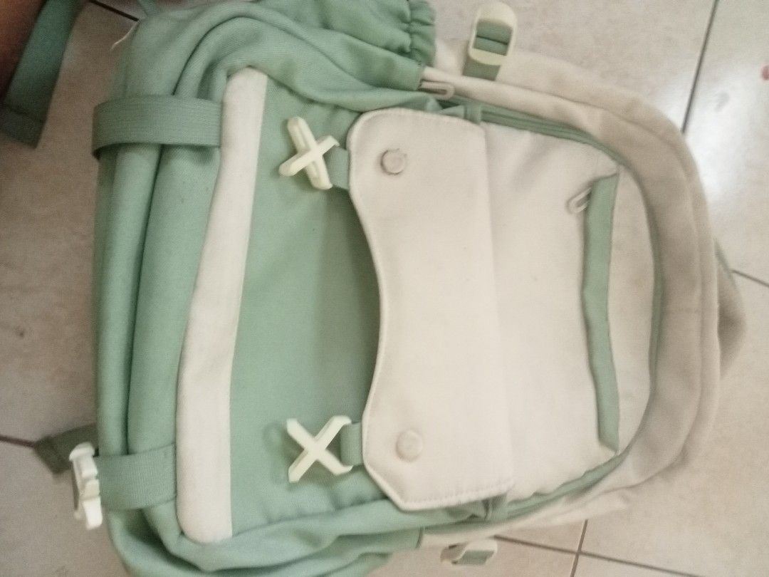 Light Green and Cream Backpack (Category: Luxury Bags & Wallets) located in Calamba. Submitted by aaronlualhati (Listing ID 1461256181, Image 1). Description: - Adorable light green and cream backpack - Features multiple front pockets and side pouches - Adjustable straps for a comfortable fit - Smooth-working zippers for easy access - Ample interior space for your essentials - Ideal for school, work, or everyday adventures.