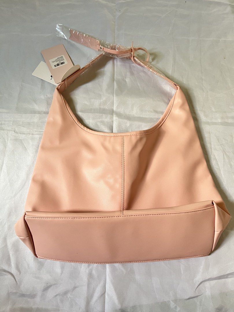Light Pink Hobo Shoulder Bag (Category: Luxury Bags & Wallets) located in San Fernando. Submitted by lexuexs (Listing ID 1461171897, Image 1). Description: 💌 bought this on Mr. DIY 💌 nbu still with tag ❕non negotiable ❕light pink color in actual (photo may vary due to lighting) ❕can do vc for viewing of the product ❕do not dm if unsure — let's not waste each other's time ;) .