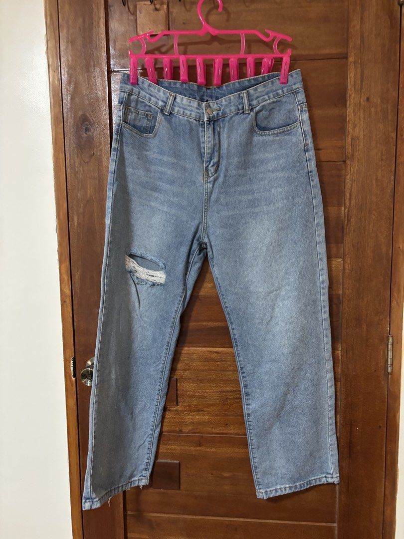Light Wash Ripped Wide Leg Jeans (Category: Jeans) located in Trece Martires City. Submitted by decluttercloset_niks (Listing ID 1461230870, Image 1). Description: - Light wash denim - Ripped detail on one leg - Wide leg silhouette - Size XXL - Casual and trendy style.