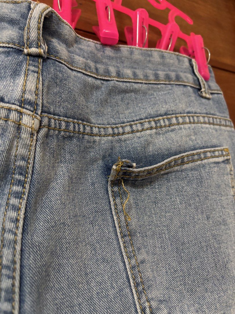 Light Wash Ripped Wide Leg Jeans (Category: Jeans) located in Trece Martires City. Submitted by decluttercloset_niks (Listing ID 1461230870, Image 3). Description: - Light wash denim - Ripped detail on one leg - Wide leg silhouette - Size XXL - Casual and trendy style.