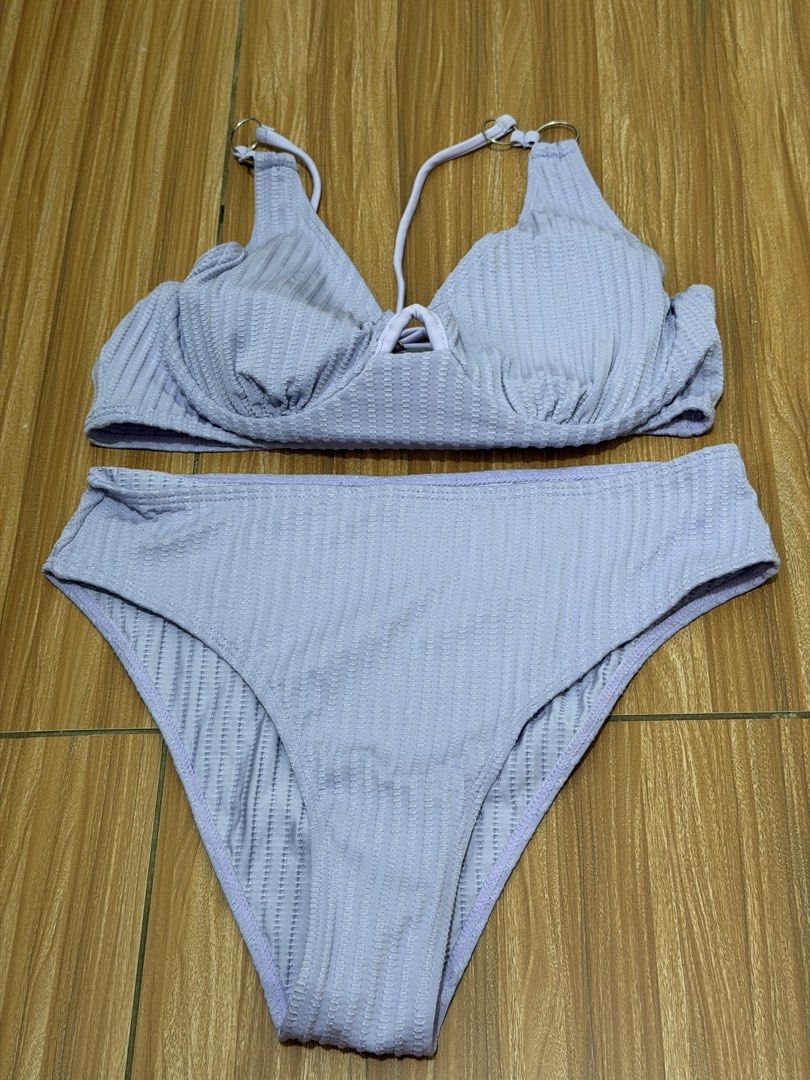 Lilac Textured Bikini Set Size M (Category: Bikinis & Swimsuits) located in San Mateo. Submitted by shane2208 (Listing ID 1461265682, Image 1). Description: NOT USED EVEN ONCE RFS WRONG SIZE - Cute lilac bikini set - Textured fabric all over - Adjustable straps - Cute tie detail at the front of the top - High-waisted bottoms - Size: M - Made in China.