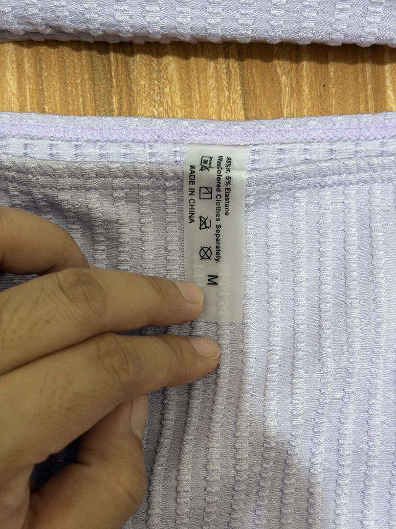 Lilac Textured Bikini Set Size M (Category: Bikinis & Swimsuits) located in San Mateo. Submitted by shane2208 (Listing ID 1461265682, Image 3). Description: NOT USED EVEN ONCE RFS WRONG SIZE - Cute lilac bikini set - Textured fabric all over - Adjustable straps - Cute tie detail at the front of the top - High-waisted bottoms - Size: M - Made in China.