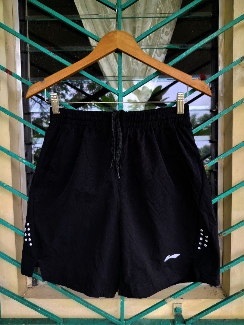 Li-Ning Black Athletic Shorts (Category: Shorts) located in Manila. Submitted by virgiliosa38485 (Listing ID 1461191896, Image 2). Description: - Brand: Li-Ning - Color: Black - Features: Elastic waistband with drawstring, small reflective details on sides - Material: Quick-dry fabric - Ideal for: Running, workouts, gym sessions.