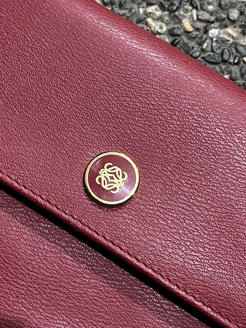 LOEWE ANAGRAM BIFOLD WALLET (Category: Luxury Bags & Wallets) located in San Fernando. Submitted by archivalhighlights (Listing ID 1461293853, Image 2). Description: LOEWE ANAGRAM BIFOLD WALLET CONDITION-10/10 MATERIAL-BURGUNDY DEEP RED LOGO-GOLD-TONE BUTTON CLASP MADE IN - MADRID.