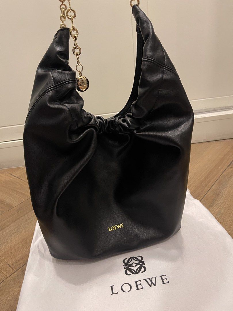 Loewe bag (Category: Luxury Bags & Wallets) located in Mandaluyong City. Submitted by soarphoenix2025 (Listing ID 1461252237, Image 1). Description: - Loewe Squeeze medium black leather shoulder bag - Elegant soft leather - Adjustable gold chain strap - Interior zip pocket for essentials - Comes with dust bag Location: Mandaluyong Payment via gcash or BPI.