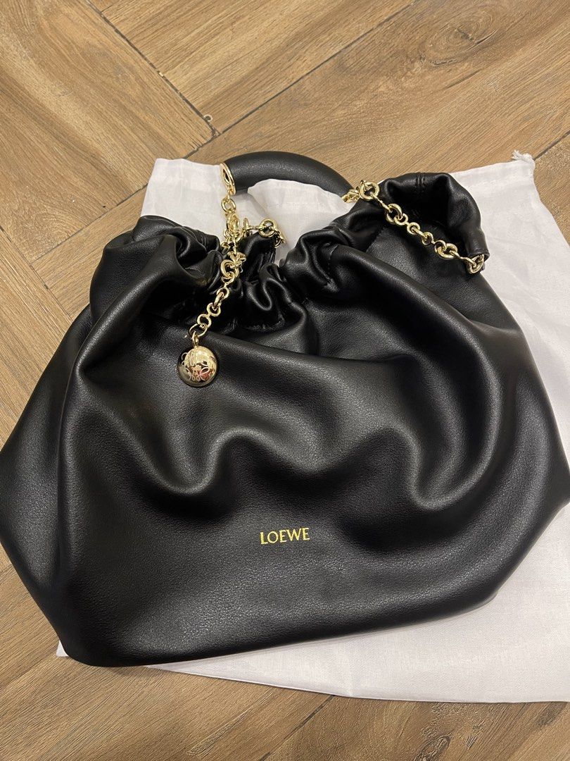Loewe bag (Category: Luxury Bags & Wallets) located in Mandaluyong City. Submitted by soarphoenix2025 (Listing ID 1461252237, Image 3). Description: - Loewe Squeeze medium black leather shoulder bag - Elegant soft leather - Adjustable gold chain strap - Interior zip pocket for essentials - Comes with dust bag Location: Mandaluyong Payment via gcash or BPI.