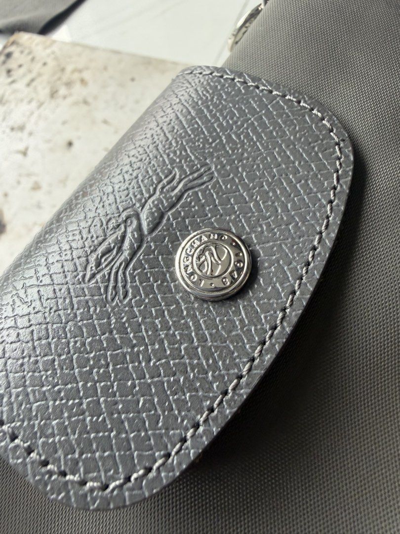 Longchamp (Category: Sling Bags) located in Quezon City. Submitted by macleen17 (Listing ID 1461258002, Image 3). Description: LongChamp Grey color Small bag sling Excellent Condition Minimal fade color only Made in tunisia.