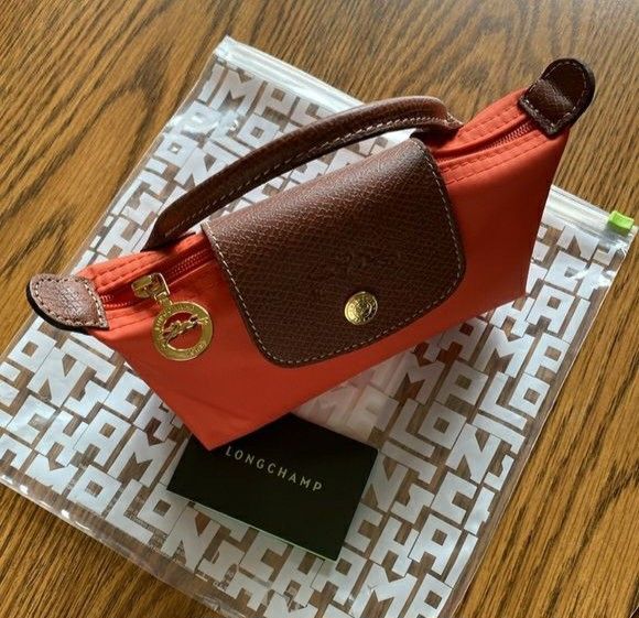 Longchamp Le Pliage Cosmetic Pouch Orange (Category: Luxury Bags & Wallets) located in Manila. Submitted by aizahsy (Listing ID 1461177292, Image 1). Description: LONGCHAMP Le Pliage Original Pouch THIS ONE DESERVES A SPOT IN YOUR CLOSET. 👜❤️ If you've been planning to get your own Longchamp, next batch is now open. DM to order your dream bag. 😀 🇫🇷 Made in France 🌏 Sourced from Europe 💯 Authentic 👌Open for layaway. #longchamp #longchampori