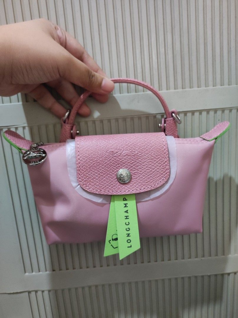 Longchamp Le Pliage Cuir Mini Top Handle Bag Pink (Category: Luxury Bags & Wallets) located in Marikina City. Submitted by kylacastillo03 (Listing ID 1461238614, Image 1). Description: - Original pink/rose Longchamp mini bag - Money back Guaranteed if prover fake - Zipper closure with snap button flap - Small size, ideal for essentials - Detachable strap included.