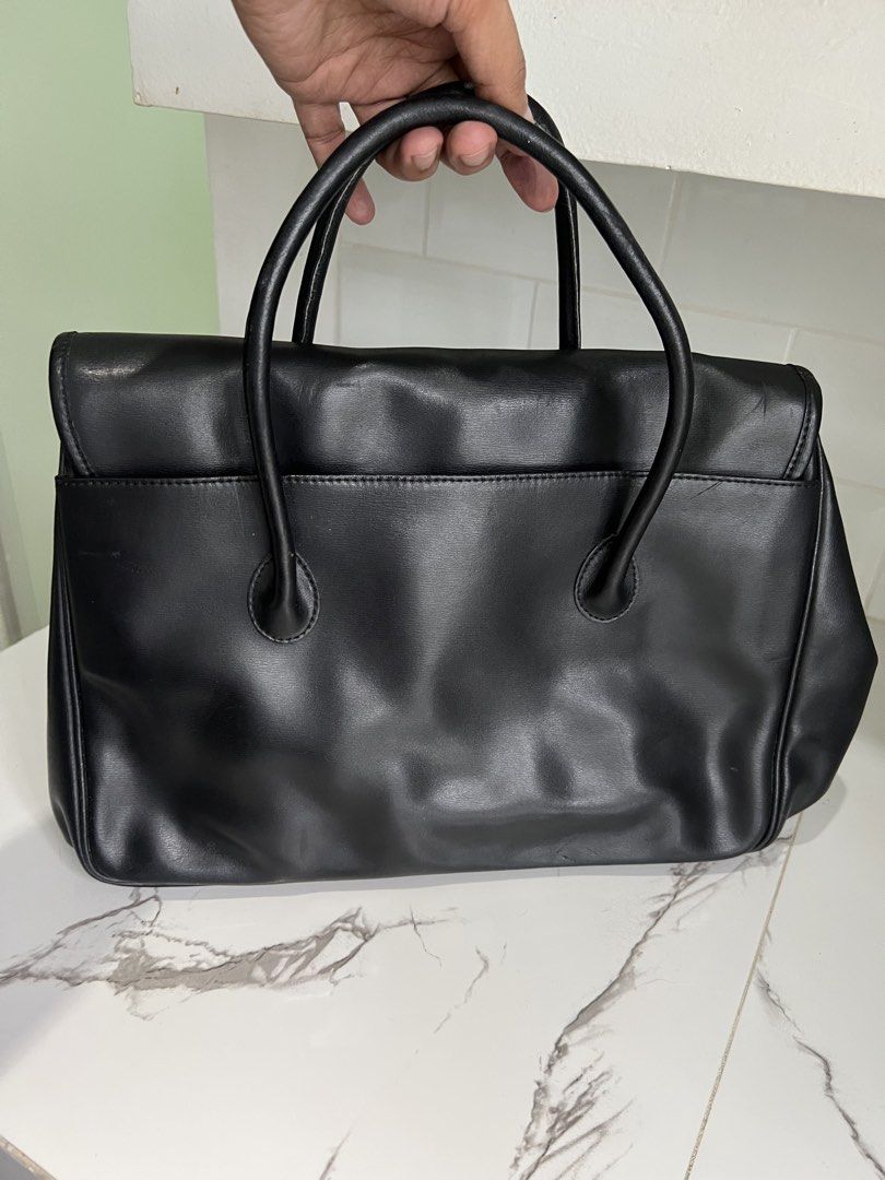 Authentic Longchamp Leather Handbag (Category: Luxury Bags & Wallets) located in Cavite. Submitted by slumbermanila (Listing ID 1461260945, Image 2). Description: Longchamp Leather Handbag in leather material brand tag inside with code issue; tearing/ broken in in connecting handle part kayo na magdikit/ pa repair .