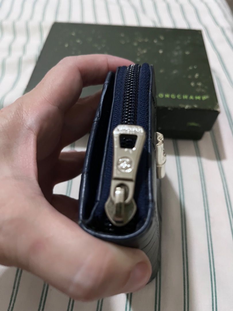 Longchamp Navy Blue Croc Embossed Leather Zip Around Wallet (Category: Wallets & Card holders) located in Muntinlupa City. Submitted by closet_queen_13 (Listing ID 1461257009, Image 3). Description: - Navy blue Longchamp wallet - Croc embossed leather - Zip around closure - Interior card slots and compartments - Comes with original box - Ideal for organizing essentials - Brand new with tags, box faded due to storage. - Bought in Rustan’s .