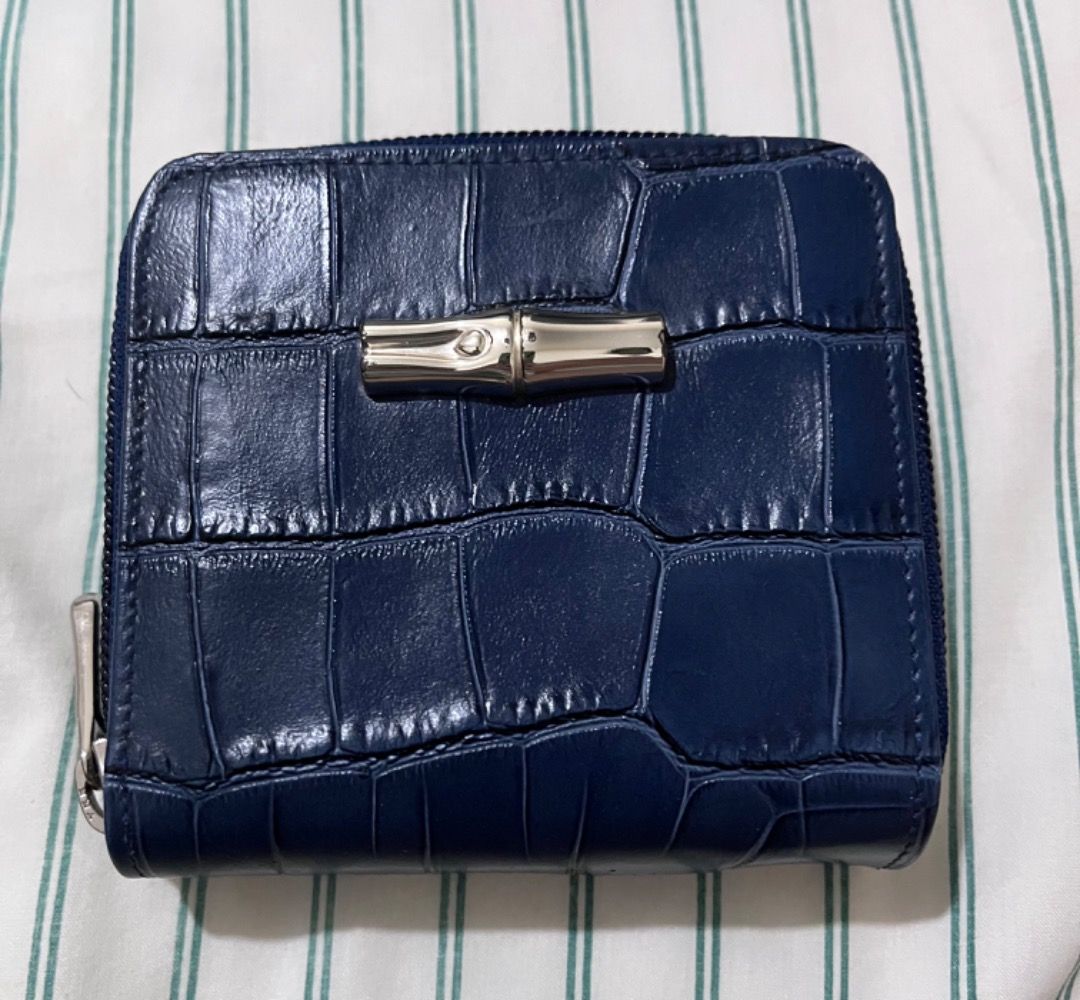 Longchamp Navy Blue Croc Embossed Leather Zip Around Wallet (Category: Wallets & Card holders) located in Muntinlupa City. Submitted by closet_queen_13 (Listing ID 1461257009, Image 1). Description: - Navy blue Longchamp wallet - Croc embossed leather - Zip around closure - Interior card slots and compartments - Comes with original box - Ideal for organizing essentials - Brand new with tags, box faded due to storage. - Bought in Rustan’s .