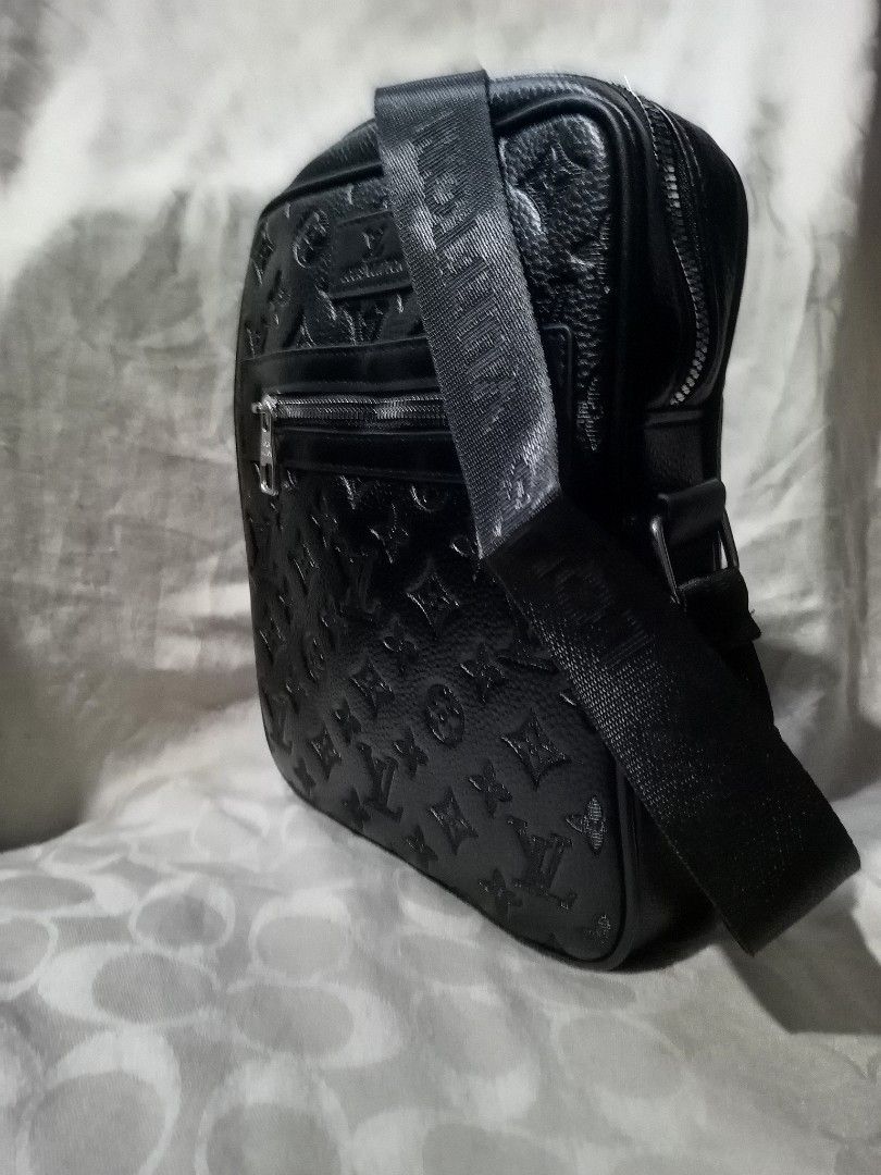Louis Vuitton Black Monogram Crossbody Bag (Category: Luxury Bags & Wallets) located in Aguinaldo. Submitted by baguioukayukay2600 (Listing ID 1461115756, Image 3). Description: - Louis Vuitton crossbody bag - Iconic all-over monogram pattern - Front zippered pocket - Spacious main compartment - Adjustable strap with 'LOUIS VUITTON' text - Silver-tone hardware with LV branded zipper pull - Ideal for everyday wear.