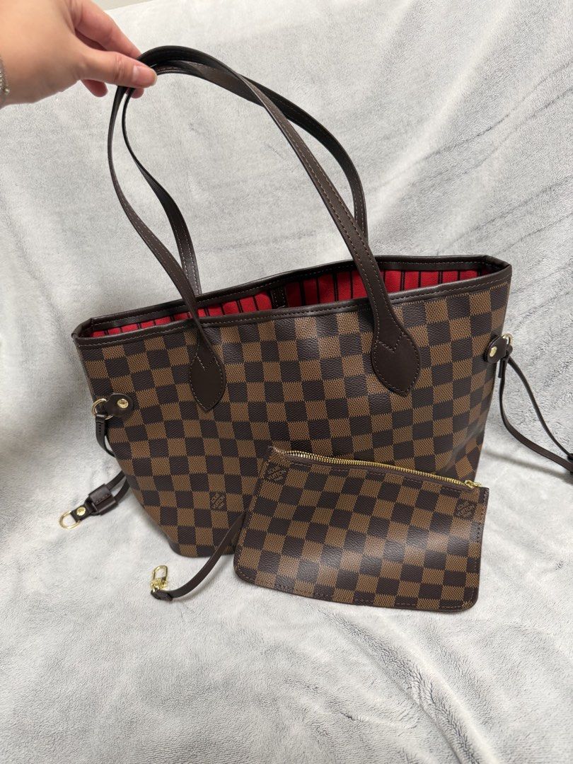 Louis Vuitton Damier Azur Neverfull MM with Pouch (Category: Luxury Bags & Wallets) located in Quezon City. Submitted by patbuys (Listing ID 1461281979, Image 1). Description: - Yellow app Louis Vuitton Neverfull PM - Damier Azur canvas with vibrant red striped interior - Includes matching pochette - Elegant gold hardware details - Spacious main compartment with interior zip pocket - Perfect for everyday use - Canvas is clean and well-maintained.