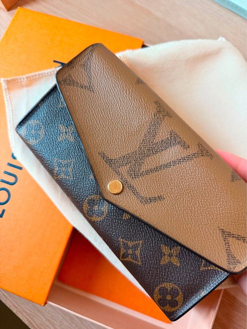 Louis Vuitton Monogram Canvas Wallet (Category: Luxury Bags & Wallets) located in Binan City. Submitted by mlvtg (Listing ID 1461221063, Image 1). Description: - Authentic Louis Vuitton wallet - Classic monogram canvas - Secure snap closure - Interior zippered coin pocket - Multiple card slots and compartments - Comes with original box and dust bag - Perfect for organizing your essentials.