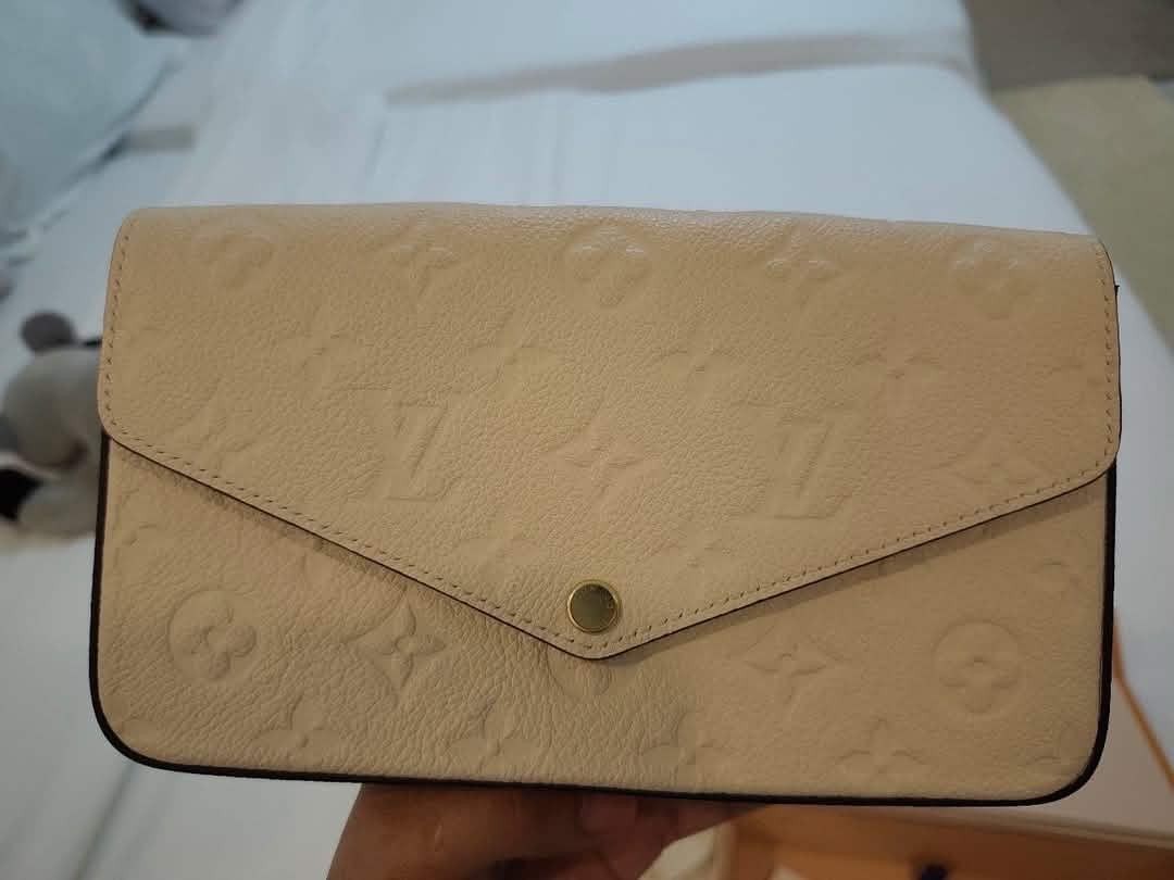 Louis Vuitton Monogram Empreinte Wallet Pouch Card Holder Set (Category: Luxury Bags & Wallets) located in Manila. Submitted by lumangukay (Listing ID 1461143576, Image 3). Description: - Authentic Louis Vuitton Set - Color: Cream/Beige - Includes: Envelope Wallet with Chain, Zip Pouch, Card Holder - Pattern: Embossed Monogram Empreinte - Comes with: Dust Bag - Ideal for: Organizing essentials or as a gift.