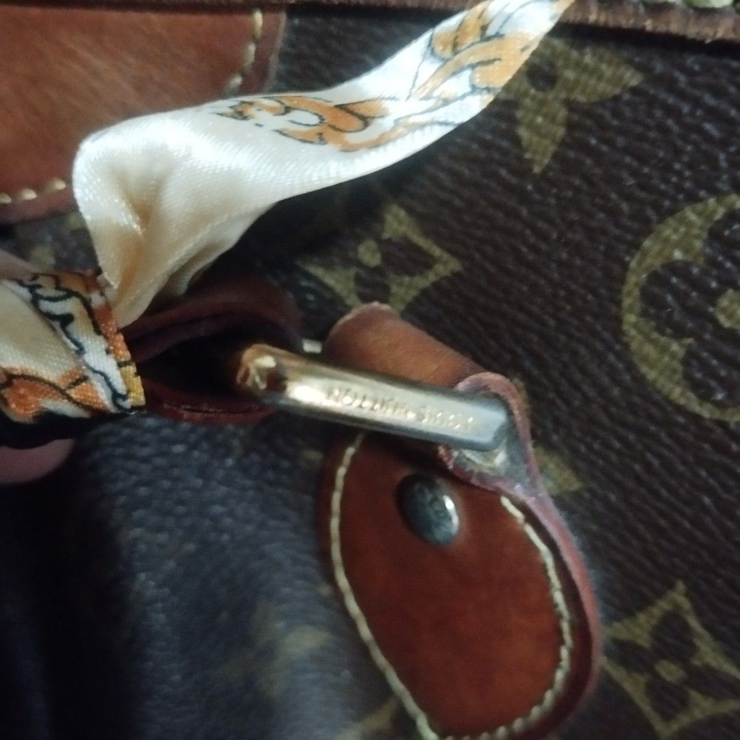 Louis Vuitton Monogram palermo Bag with Scarf (Category: Tote Bags) located in Manila. Submitted by lene48 (Listing ID 1461284491, Image 3). Description: - Classic Louis Vuitton Speedy monogram bag - Features leather trim and handles - Secure zipper closure - Comes with a charming silk scarf tied to the handle - Shows some signs of wear on leather trim and metal hardware - Ideal for everyday use, coded.