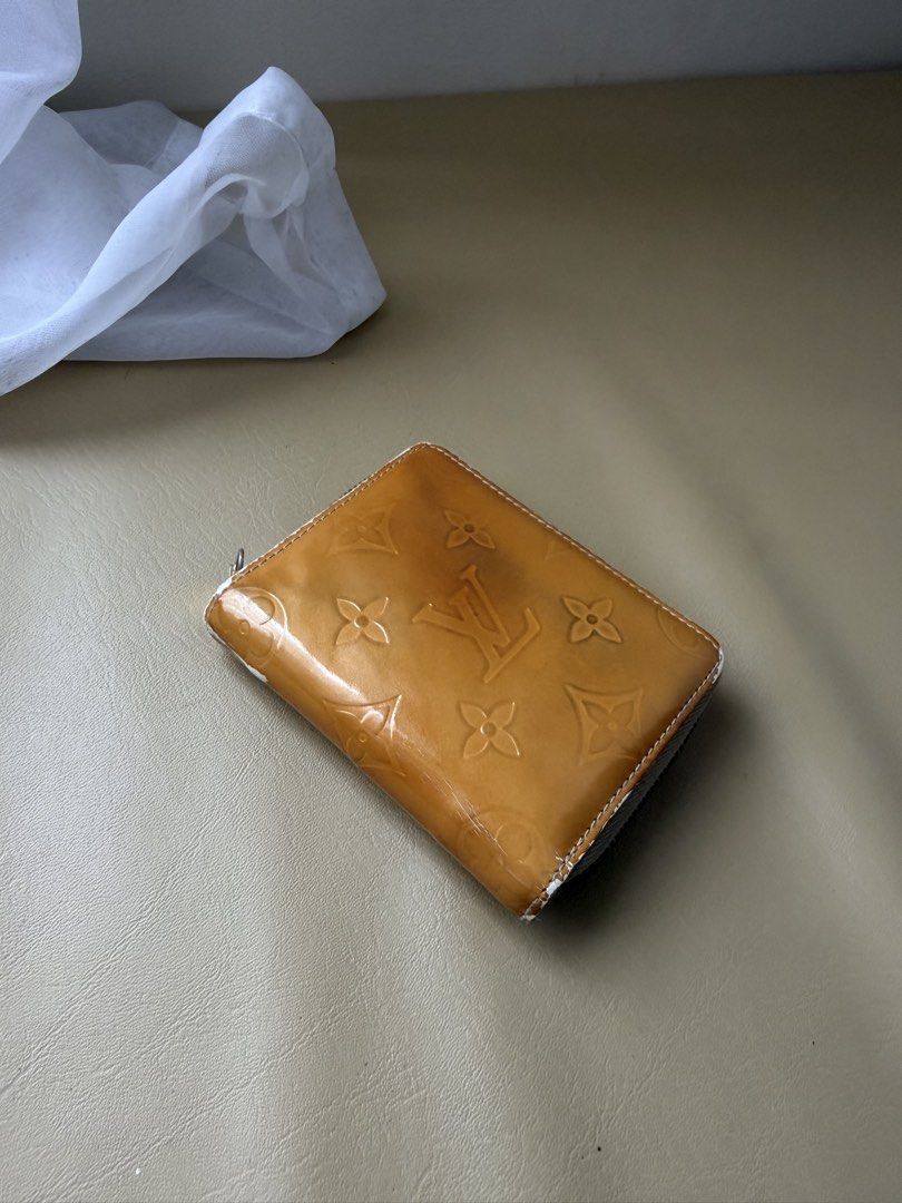 Louis Vuitton Monogram Vernis Zippy Wallet (Category: Luxury Bags & Wallets) located in Alfonso. Submitted by jbcamet (Listing ID 1461157159, Image 2). Description: - Authentic Louis Vuitton Zippy Wallet - Material: Monogram Vernis Leather - Color: Honey/Orange - Interior: Multiple card slots and a zippered compartment - Zipper: Smooth and functional.