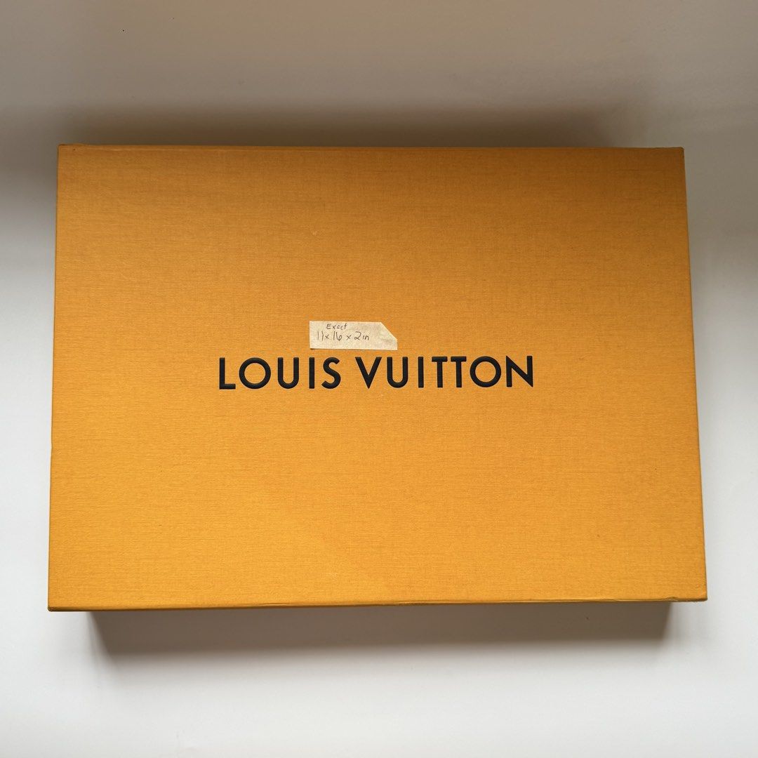 Louis Vuitton Orange Box (Category: Luxury Bags & Wallets) located in Santa Rosa. Submitted by le_classique (Listing ID 1461198288, Image 1). Description: - Authentic Louis Vuitton box - Vibrant orange exterior with iconic black logo - Light tan interior - Approximate dimensions: 11 x 16 x 2 inches - Includes original Louis Vuitton tissue paper - Ideal for storing small valuables or as a luxurious gift box.