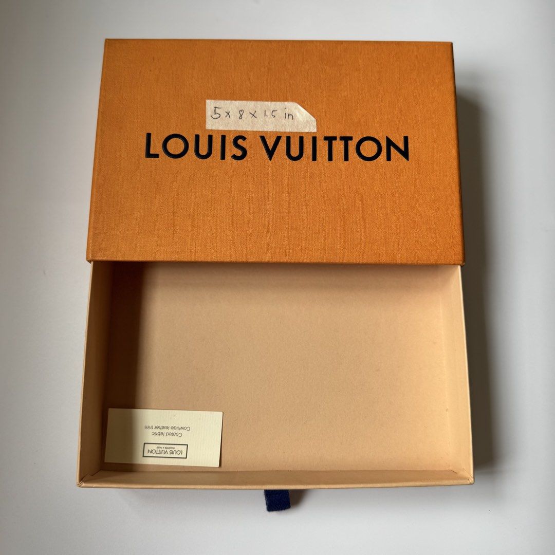 Louis Vuitton Orange Box (Category: Luxury Bags & Wallets) located in Santa Rosa. Submitted by le_classique (Listing ID 1461200152, Image 2). Description: - Authentic Louis Vuitton box - Vibrant orange exterior with classic black Louis Vuitton lettering - Light tan interior - Comes with a small information card - Dimensions are marked on the lid - Ideal for storing small valuables or as a luxurious gift box.