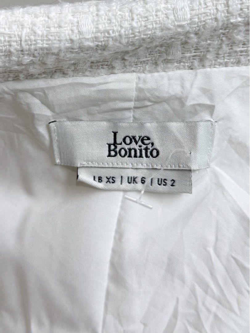 Love, Bonito White Tweed Blazer (Category: Sets or Coordinates) located in Cabanatuan. Submitted by alysanne0910 (Listing ID 1461122978, Image 3). Description: Size: XS Can do shipping nationwide. Courier: J&T. Shipping fee to be shouldered by buyer. - Love, Bonito white tweed blazer and matching mini skirt set - Blazer features classic lapel and button closure - Skirt is mini length - Ideal for smart casual outfits or work attire - Size XS.