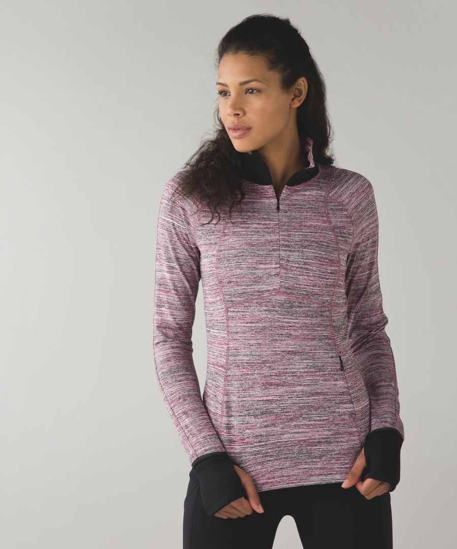 Lululemon Athletica Long Sleeve Half Zip Pullover Top (Category: Activewear) located in Baguio. Submitted by sky_alexander143 (Listing ID 1461302913, Image 2). Description: - Pink and grey marled long sleeve athletic top - Features a half zip neckline - Includes thumbholes for extra comfort and coverage - Made with comfortable and breathable fabric, ideal for running or workouts - Reflective details on the cuffs for enhanced visibility.