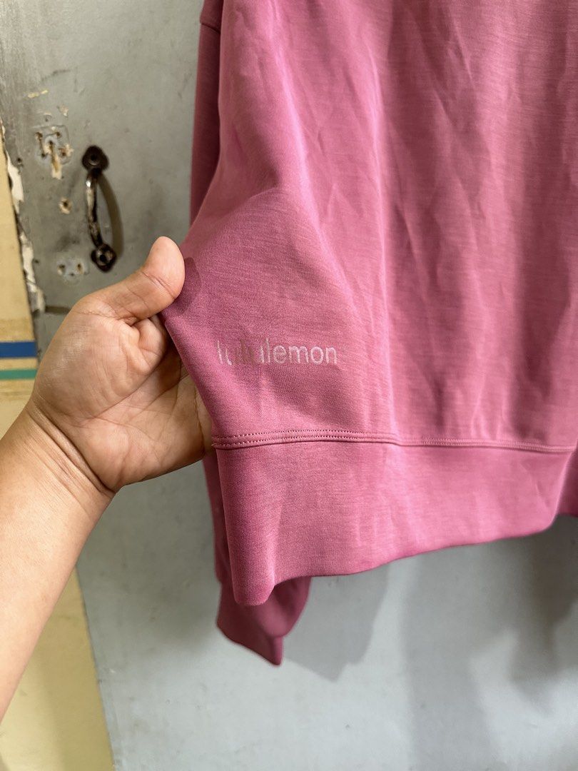 Lululemon Crewneck Sweatshirt Dusty Rose (Category: Longsleeves) located in Angeles City. Submitted by alejeong27 (Listing ID 1461156944, Image 3). Description: - Brand: Lululemon - Color: Dusty Rose - Style: Cropped Crewneck Sweatshirt - Features: Long sleeves with elastic cuffs - Fabric: Soft and comfortable - Details: Subtle embroidered Lululemon logo on the side - Occasion: Casual wear, easy to pair with leggings or jeans.