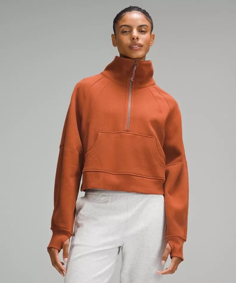 Lululemon Cropped Half-Zip Sweatshirt - Burnt Orange (Category: Coats, Jackets and Outerwear) located in Cebu City. Submitted by booksii3232 (Listing ID 1461178549, Image 1). Description: - Lululemon cropped sweatshirt in burnt orange - High neck with half-zip closure - Convenient kangaroo pocket - Thumbholes at the cuffs for extra warmth - Cozy soft fleece interior - Versatile for layering or standalone wear - Comfortable and stylish design 1250