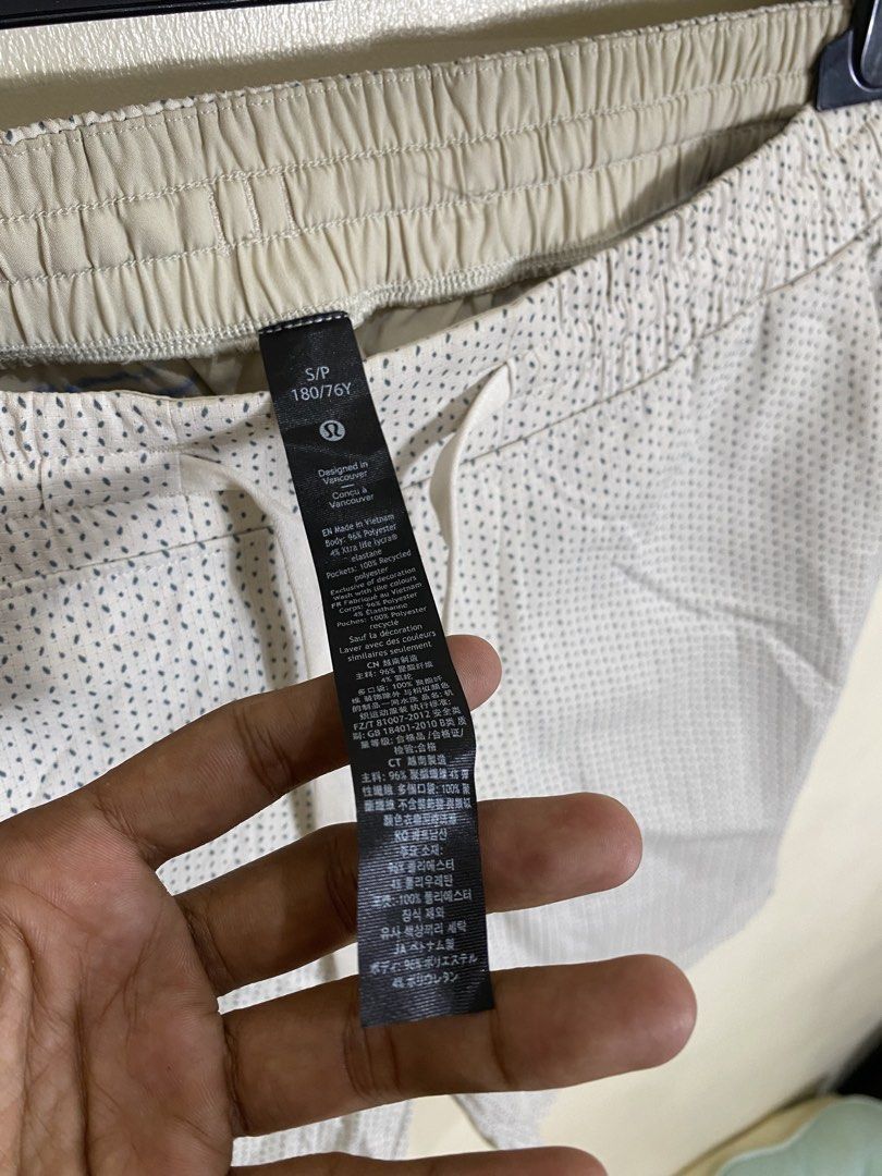 Lululemon Shorts S/P 180/76Y White Dot Pattern (Category: Activewear) located in Manila. Submitted by carbertjakosalem (Listing ID 1461311181, Image 3). Description: - Lululemon shorts - Size: S/P - Color: White with subtle dark dot pattern - Features: Elastic waistband with drawstring, front pockets, back pocket - Material: Made in Vietnam - Ideal for: Workouts, casual wear.