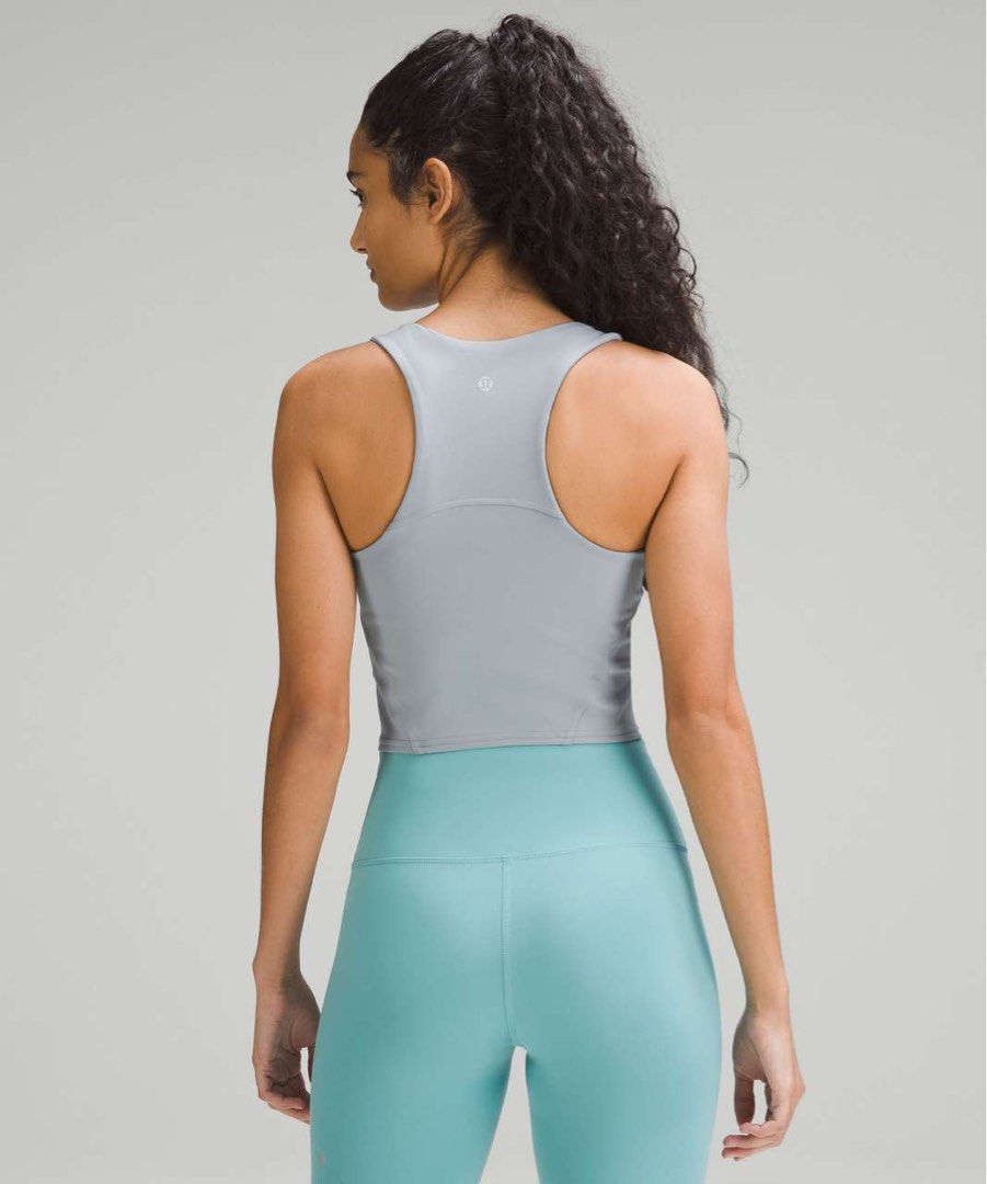 Lululemon Wunder Train Racerback Tank Top Chambray "4 (Category: Activewear) located in Manila. Submitted by thriftfinds_309 (Listing ID 1461299269, Image 1). Description: - Grey Lululemon cropped sports bra - Comfortable racerback design - Soft and smooth fabric - Ideal for workouts or everyday wear - Looks great with high-waisted leggings.