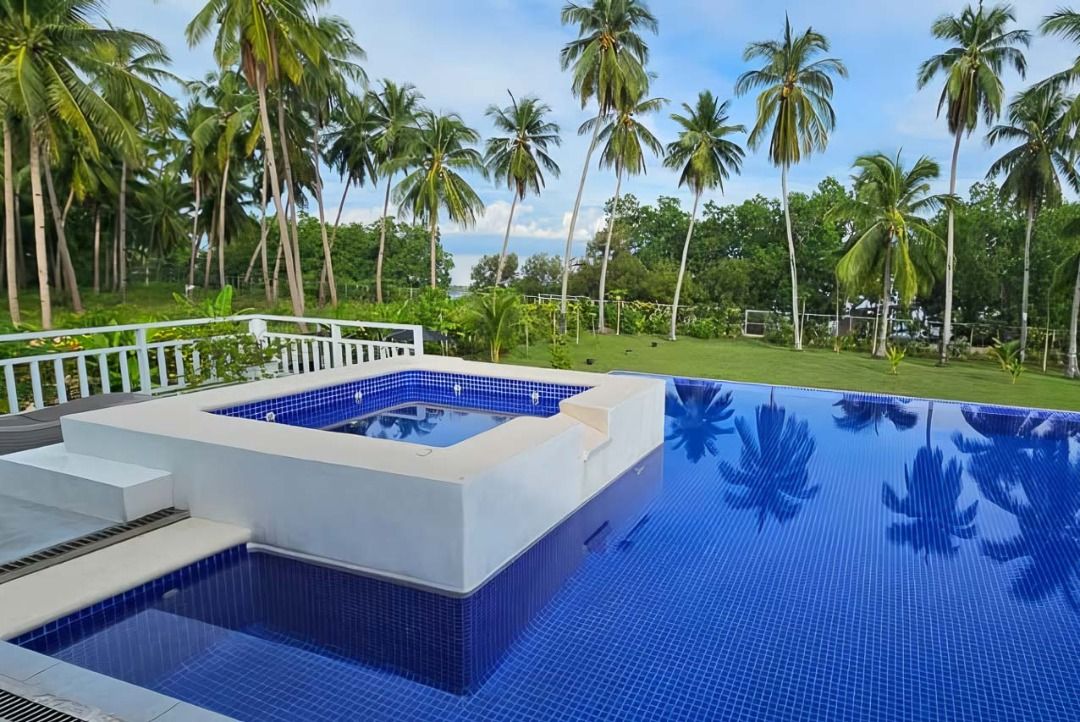Luxury Tropical Escape with Infinity Pool and Private Pier (Category: House & Lot) located in Manila. Submitted by cebugrandrealty (Listing ID 1461130277, Image 3). Description: Property ID: SRBT1 Type: House and Lot for Sale Location: Cogon, Tuburan, Cebu Bedrooms: 7 Bathrooms: 7 Floor Area: 2,500 SqM Lot Area: 4,800 SqM Parking: 5 car spaces Furnishing: Furnished Price: PHP90,000,000 Property Features: • Tropical estate with spacious indoor and