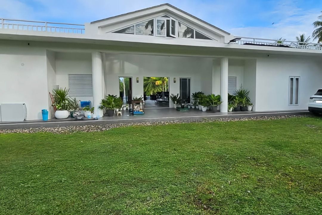 Luxury Tropical Escape with Infinity Pool and Private Pier (Category: House & Lot) located in Manila. Submitted by cebugrandrealty (Listing ID 1461130277, Image 1). Description: Property ID: SRBT1 Type: House and Lot for Sale Location: Cogon, Tuburan, Cebu Bedrooms: 7 Bathrooms: 7 Floor Area: 2,500 SqM Lot Area: 4,800 SqM Parking: 5 car spaces Furnishing: Furnished Price: PHP90,000,000 Property Features: • Tropical estate with spacious indoor and