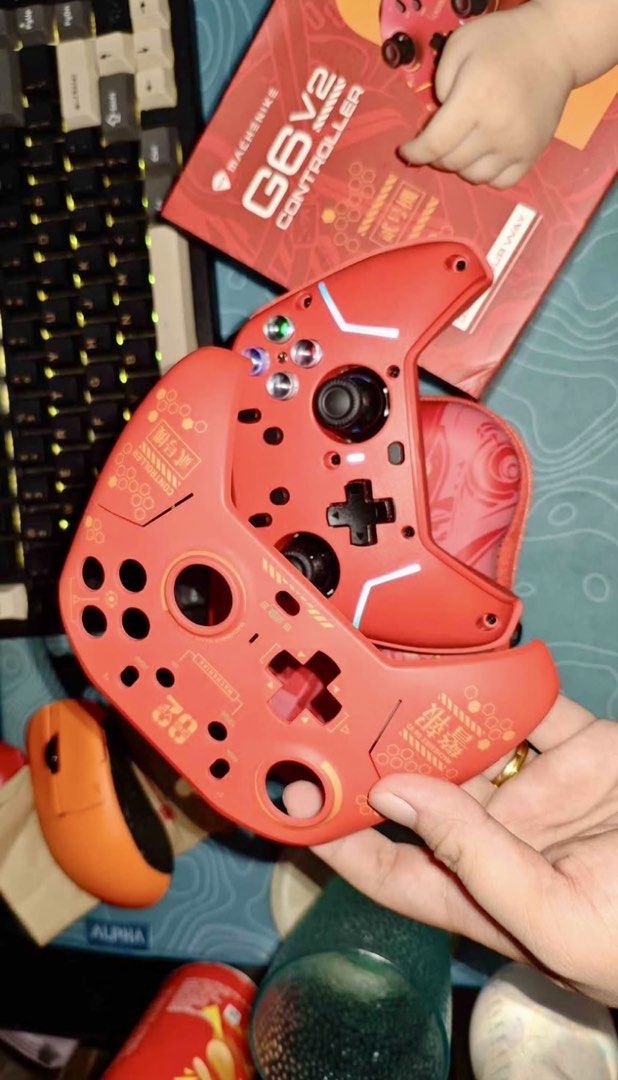 MacheNiks G6v2 Controller Red with Case (Category: Controllers) located in Manila. Submitted by trenaesg (Listing ID 1461267668, Image 2). Description: - MacheNiks G6v2 Controller in striking Red - Comes with original case for protection - Includes charging cable for convenience - Extra buttons provided for customization - Unique and eye-catching design - Perfect for an enhanced gaming experience Machenike g6 v2 premium edition red For PC, Xbox, 