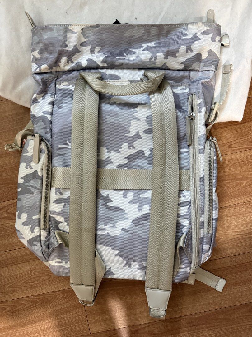 Maison Kitsuné x Samsonite Camo Backpack (Category: Backpacks) located in Makati City. Submitted by muffinstuffins (Listing ID 1461191547, Image 2). Description: - Stylish camo print backpack - Collaboration between Maison Kitsuné and Samsonite - Multiple pockets for excellent organization - Adjustable straps for a comfortable fit - Ideal for everyday use and travel - Comes with original dust bag.