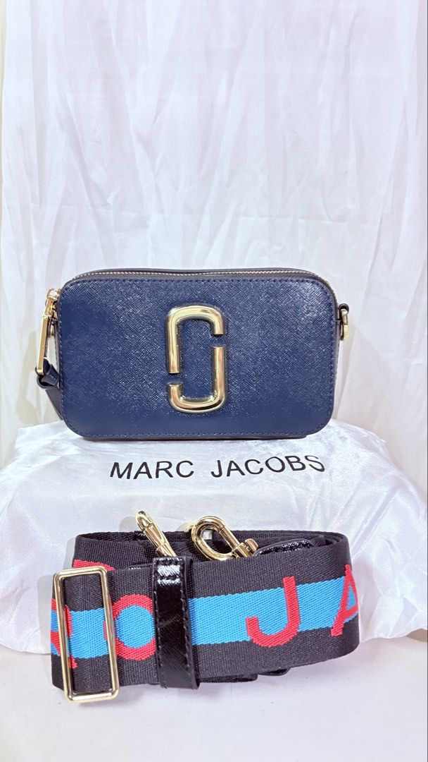 Marc Jacobs Snapshot Camera Bag Navy Blue Gold Hardware (Category: Cross-body Bags) located in Pateros City. Submitted by marifernandez (Listing ID 1461215351, Image 1). Description: - High Quality only - Navy blue Marc Jacobs Snapshot bag - Iconic gold double J logo - Detachable strap with bold lettering - Zipper closure - Interior zip pocket - Ideal for everyday use.