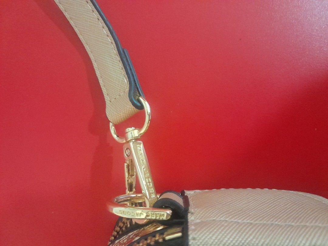 Marc Jacobs Snapshot Camera Bag Gold Sequins Snake (Category: Luxury Bags & Wallets) located in Manila. Submitted by glengpascu18784 (Listing ID 1461266808, Image 3). Description: - Gold Marc Jacobs Snapshot bag - Features shimmering sequins and chic snake print panels - Iconic double J logo detail - Includes a versatile crossbody strap - Ideal for both everyday wear and glamorous nights out - Surprisingly spacious interior for your essentials.