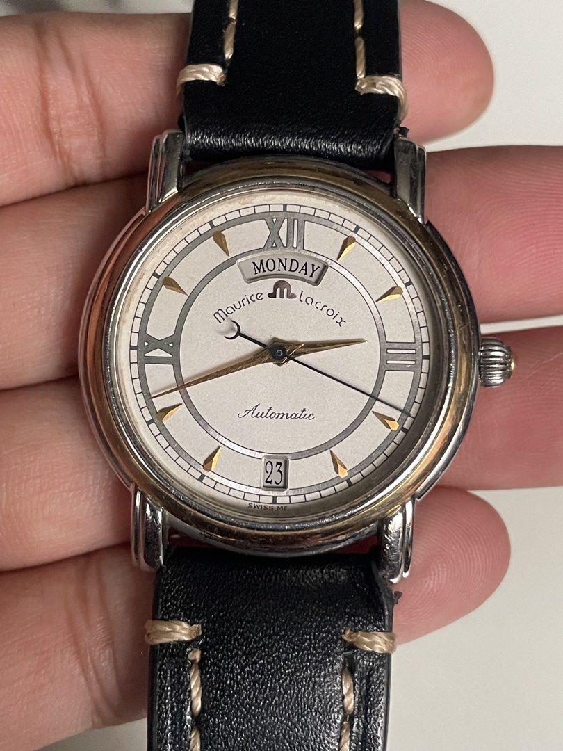 Maurice Lacroix Automatic (Category: Men's Watches) located in Taguig. Submitted by j_watches007 (Listing ID 1461175338, Image 2). Description: Authentic Secondhand ⌚ Maurice Lacroix Automatic Day/date Swiss Made 3102 09776 White dial with Roman numerals 18k Gold Bezel Sapphire crystal Stainless steel back case 34mm Replacement leather strap, buckle “Watch Only” DISCLAIMER: IT’S OLD USED WATCHES EXPECT SOME SCRATCHES, SIGNS OF USED & PLEASE MANAG