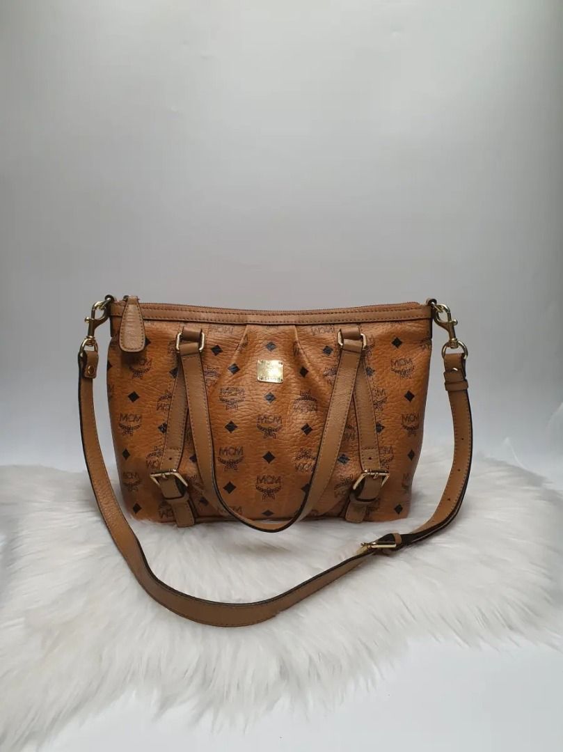 MCM Munchen Visetos Cognac Monogram Tote Bag (Category: Activewear) located in Manila. Submitted by aftermarketphilippines (Listing ID 1461174180, Image 1). Description: MCM Munchen Visetos Cognac Monogram Tote Bag 9.5/10 (Good As New) No issue Used Price : 10,000 HMU Location : San Juan.