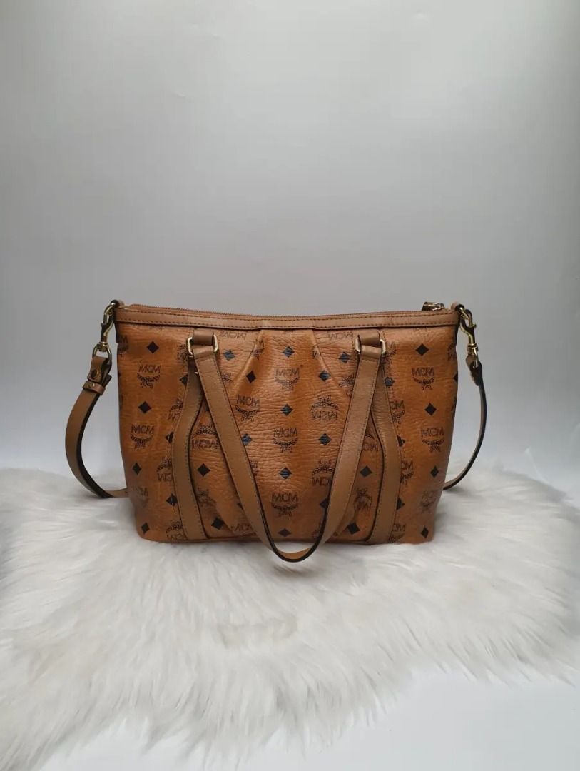 MCM Munchen Visetos Cognac Monogram Tote Bag (Category: Activewear) located in Manila. Submitted by aftermarketphilippines (Listing ID 1461174180, Image 2). Description: MCM Munchen Visetos Cognac Monogram Tote Bag 9.5/10 (Good As New) No issue Used Price : 10,000 HMU Location : San Juan.
