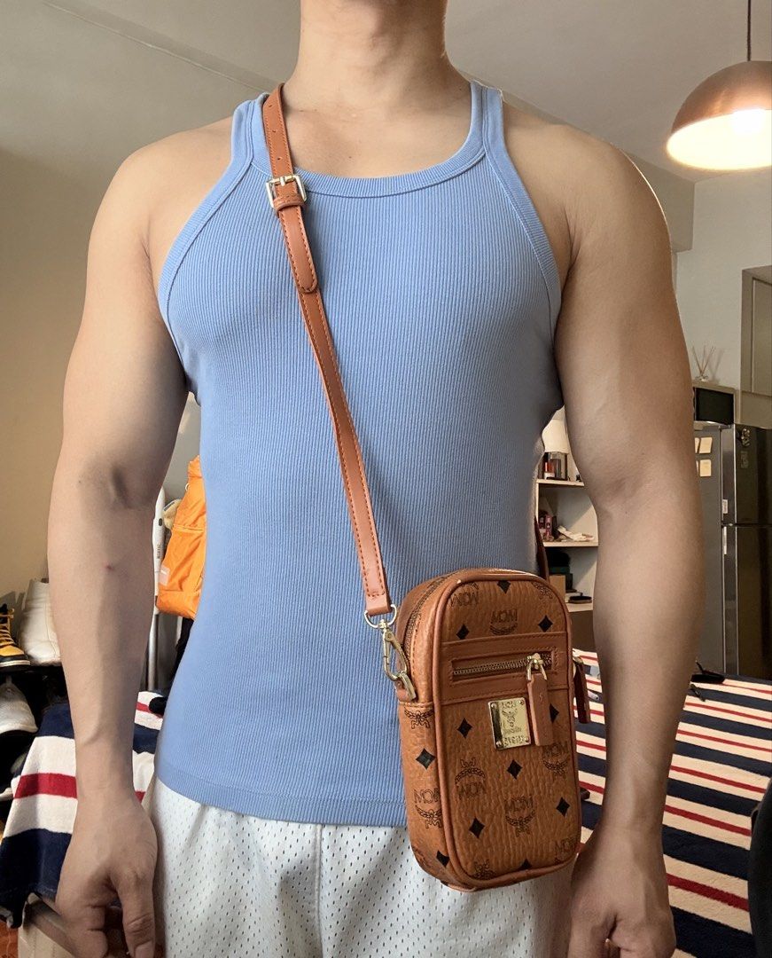 MCM Vertical Mini Crossbody Bag in Cognac (Category: Sling Bags) located in Mandaluyong City. Submitted by material_boi (Listing ID 1461161859, Image 2). Description: Used once then stored. Perfect pang-strolling lang sa mall or you don’t like carrying big bags. In iconic cognac color. Gold na gold pa hardwares nyan. Smooth zippers. With lining inside. Detachable and adjustable strap. Approx 7 inches long and 4.5 inches wide. Structured bag so it