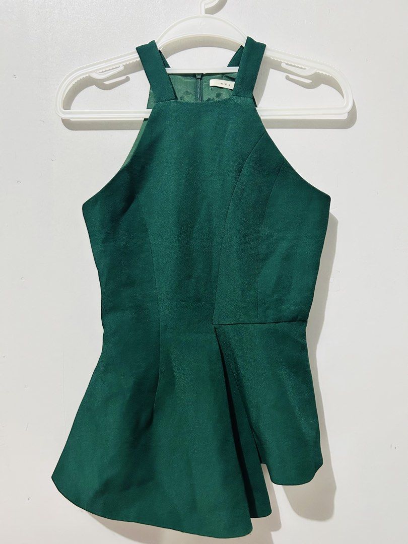 MDS Emerald Green Halter Peplum Top (Category: Blouses) located in Palo. Submitted by kaleidoscope_676 (Listing ID 1461125305, Image 1). Description: - Emerald green halter neck peplum top - Brand: MDS - Zipper closure at the back - Structured fit with a flared hem - Perfect for dressing up or down - Pairs well with skirts or trousers.