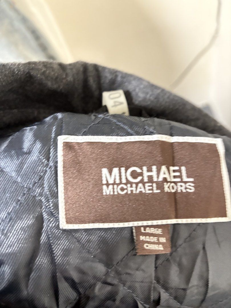 Michael Kors Grey Wool Blend Double Breasted Jacket Large (Category: Coats, Jackets and Outerwear) located in General Trias. Submitted by crissy9053136 (Listing ID 1461276201, Image 3). Description: - Michael Kors Jacket - Size: Large - Color: Grey - Material: Wool Blend - Closure: Double-breasted button - Collar: Classic - Lining: Quilted for warmth - Origin: Made in China - Ideal for: Cooler weather.