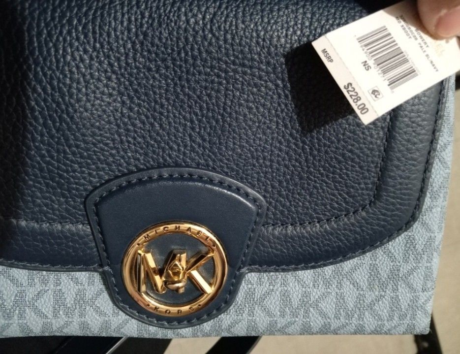 Michael Kors Navy Blue Crossbody Bag (Category: Luxury Bags & Wallets) located in Paranaque City. Submitted by chrisyel (Listing ID 1461220296, Image 2). Description: Michael Kors Navy Blue Crossbody Bag 👜✨ • Used once only • In very good / like-new condition • Gift from my aunt from Las Vegas, USA 🇺🇸 • Navy blue with MK monogram design • Long adjustable strap • No visible stains or damage • Original tag no longer available • I have a photo of