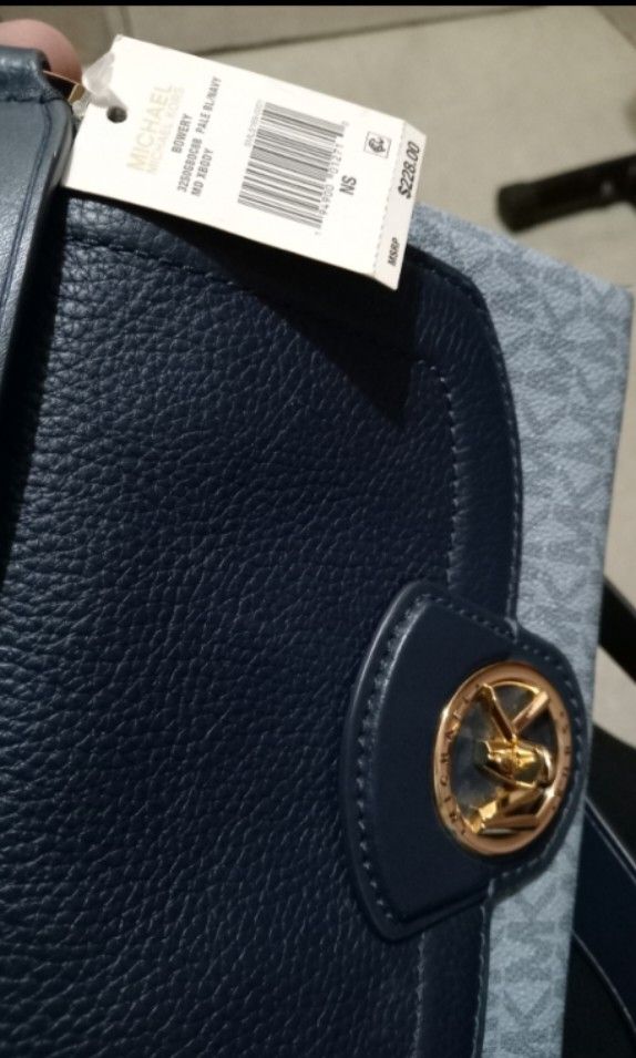 Michael Kors Navy Blue Crossbody Bag (Category: Luxury Bags & Wallets) located in Paranaque City. Submitted by chrisyel (Listing ID 1461220296, Image 1). Description: Michael Kors Navy Blue Crossbody Bag 👜✨ • Used once only • In very good / like-new condition • Gift from my aunt from Las Vegas, USA 🇺🇸 • Navy blue with MK monogram design • Long adjustable strap • No visible stains or damage • Original tag no longer available • I have a photo of