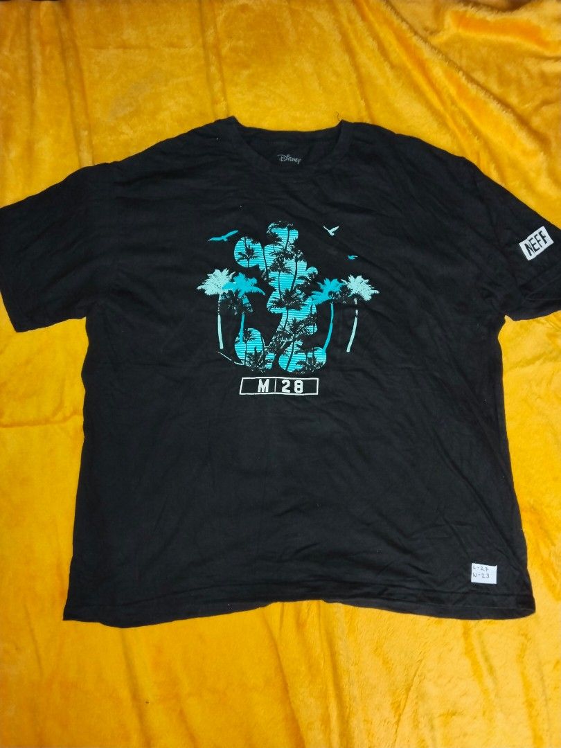 XXL Mickey Mouse Tee (Category: Tshirts & Polo Shirts ) located in Mabalacat. Submitted by al_amin_thrift (Listing ID 1461264343, Image 1). Description: Disney × Neff Mickey Mouse M-28 Tee — XXL — Official Collab Authentic Disney × Neff collaboration! Cool tropical Mickey silhouette with palm trees + "M-28". Neff logo on sleeve. Soft cotton blend. Must-have Disney streetwear! • Brand: Disney × Neff (Official) • Size: XXL (L29" × W23") • Material:
