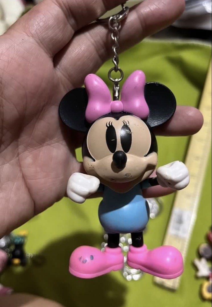 Minnie Mouse bag charm #1 AS IS (Category: Character Goods) located in Paranaque City. Submitted by bonsaiart (Listing ID 1461277871, Image 2). Description: Pre owned Minor Flaw: pen marker stain As is 200+sf Payment via GCASH or paymaya No to meetup No to cop / cod Shipping via j&t only No breaking of set or bundle.