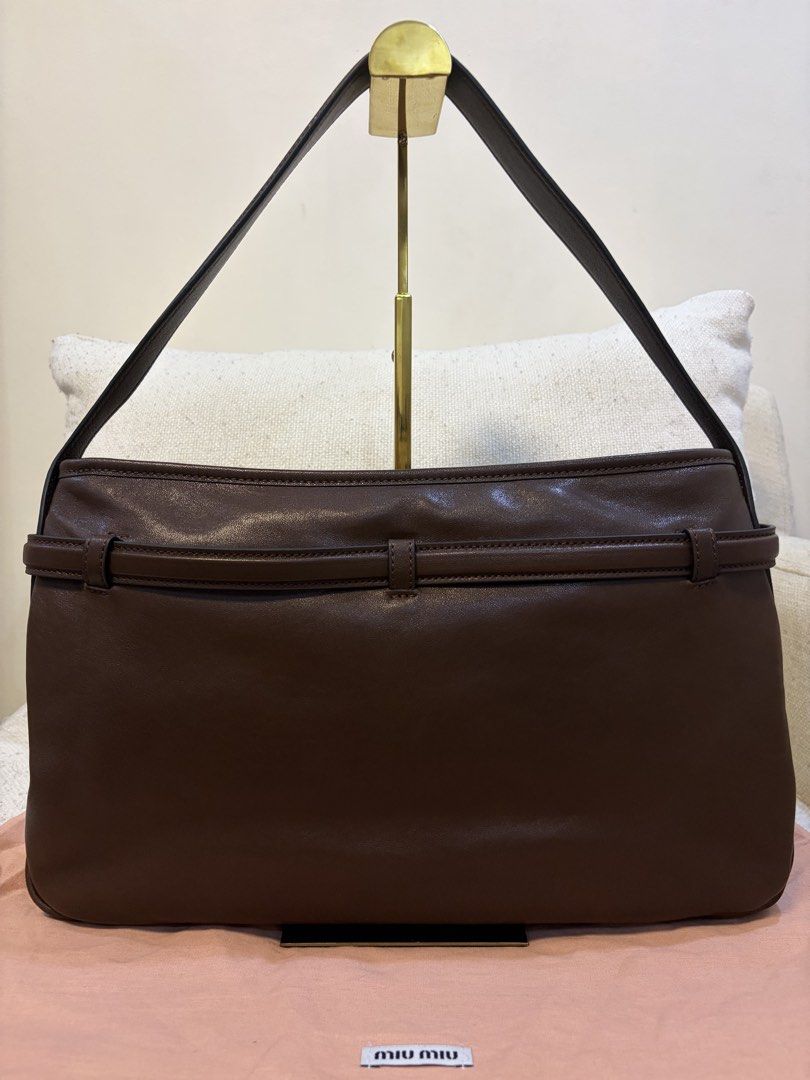 Miu Miu Aventure Hobo Bag (Category: Luxury Bags & Wallets) located in Quezon City. Submitted by kingwolf824 (Listing ID 1461229228, Image 3). Description: Miu Miu aventure belted hobo bag in this beautiful rich chocolate briarwood color. Very beautiful supple leather. Comes with dustbag and box only. Size approximately 23 cm by 37 cm. No Returns, No exchange, No refunds..