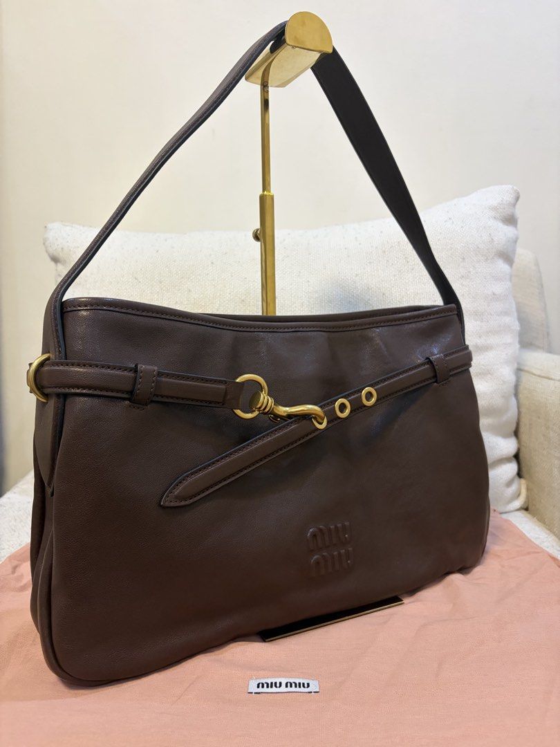 Miu Miu Aventure Hobo Bag (Category: Luxury Bags & Wallets) located in Quezon City. Submitted by kingwolf824 (Listing ID 1461229228, Image 2). Description: Miu Miu aventure belted hobo bag in this beautiful rich chocolate briarwood color. Very beautiful supple leather. Comes with dustbag and box only. Size approximately 23 cm by 37 cm. No Returns, No exchange, No refunds..