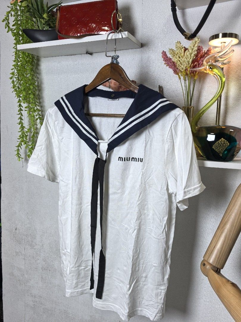 Miu Miu tshirt (Category: Luxury Apparel) located in Baguio. Submitted by ashzachary (Listing ID 1461275503, Image 2). Description: Miu Miu tshirt Condition :Excellent condition Color rate 10/10 Size :Medium to large Inches:W/L No issues No flaws Super ganda sa personal Pm. More details Good quality Plsss 📌No Bogus 📌No return MOP What you see is what you get PALAWAN, CEBUNA GCASH AND BDO Reminder😊 We're selling thrifted clothes so please manag
