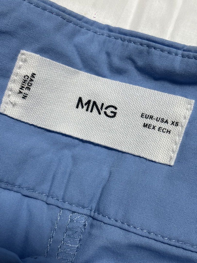 MNG Blue Tailored Shorts Size XS (Category: Shorts) located in Pasay City. Submitted by nicoletlntn_ (Listing ID 1461236020, Image 2). Description: - MNG tailored shorts - Color: Blue - Size: XS - Features: Pockets, button closure at waist - Style: Simple, classic, versatile for casual or dressed-up occasions.